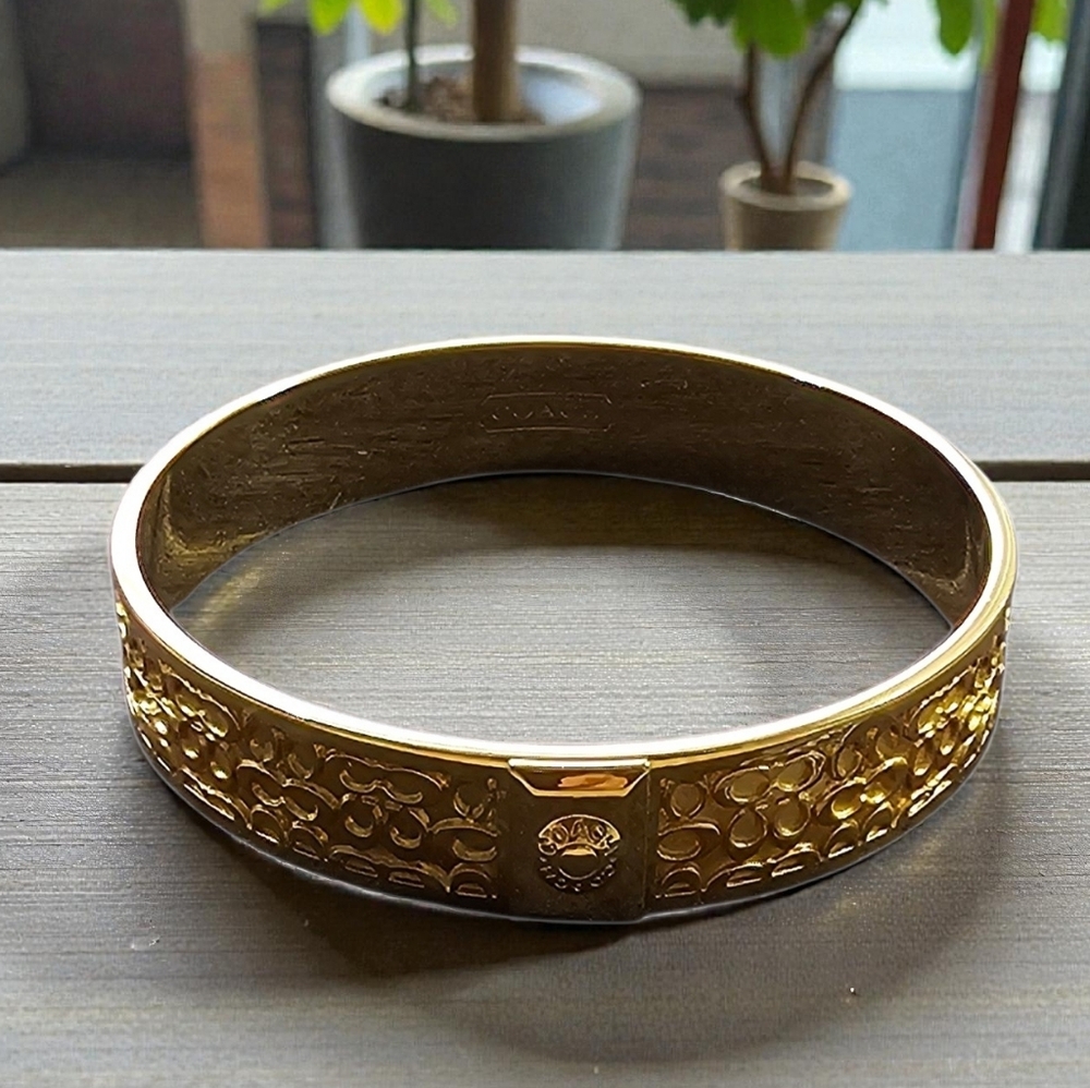 Coach Gold-Tone Embossed Bangle with Jewelry Bag